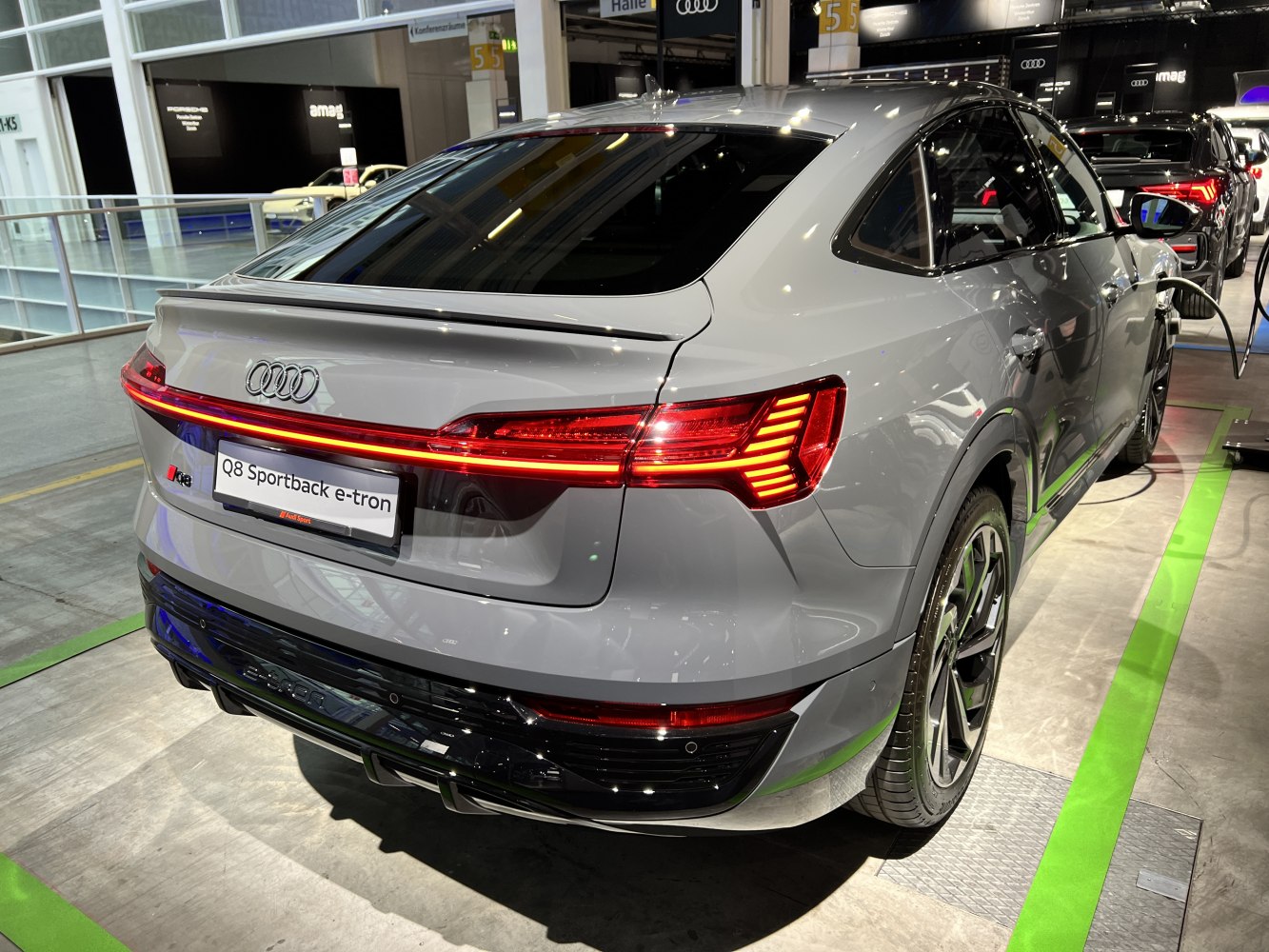 Rear view of electric SUV with LED connected tail lights and sloped roofline