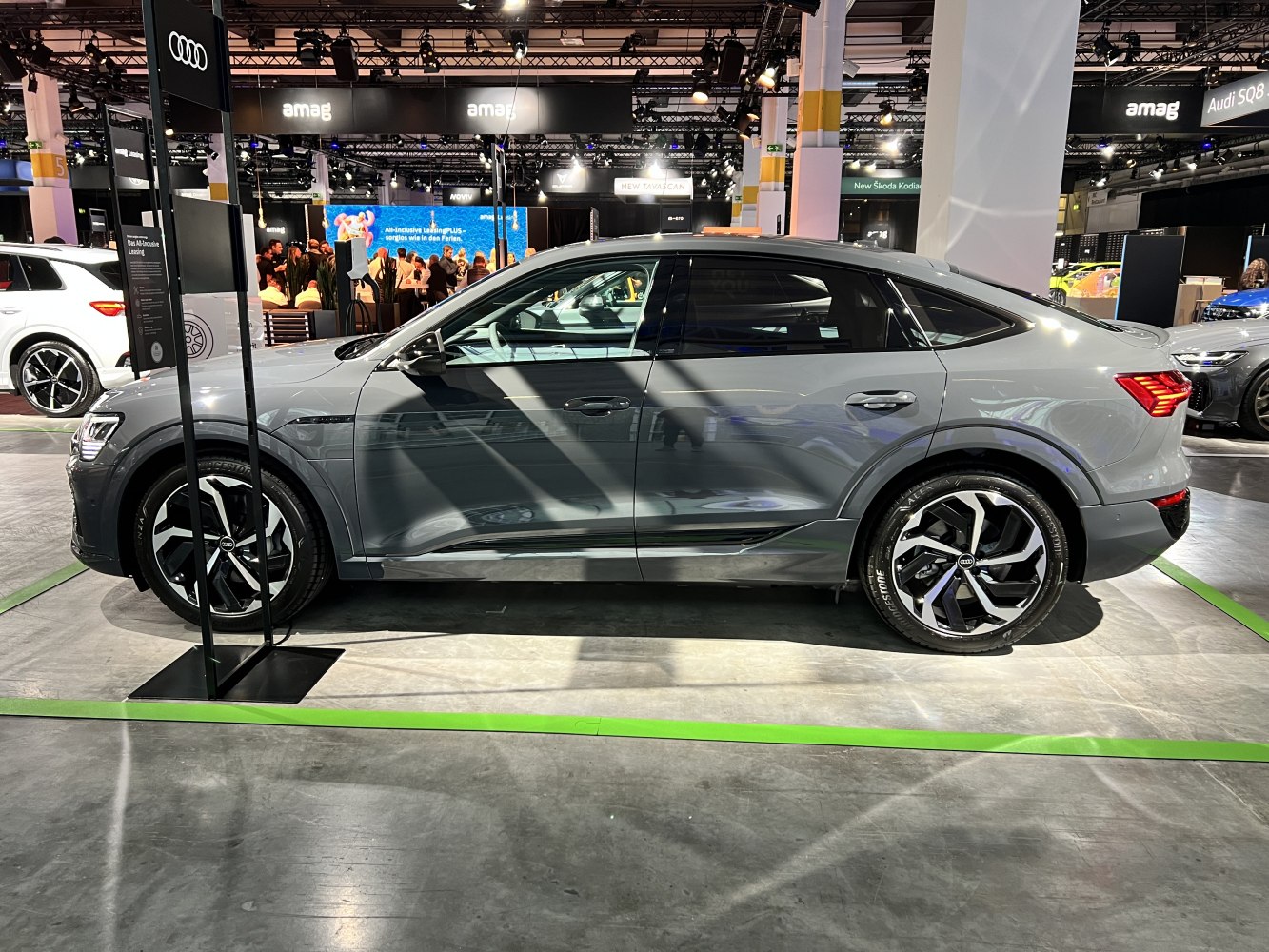 Side profile of electric SUV with distinctive alloy wheels and sleek sportback design