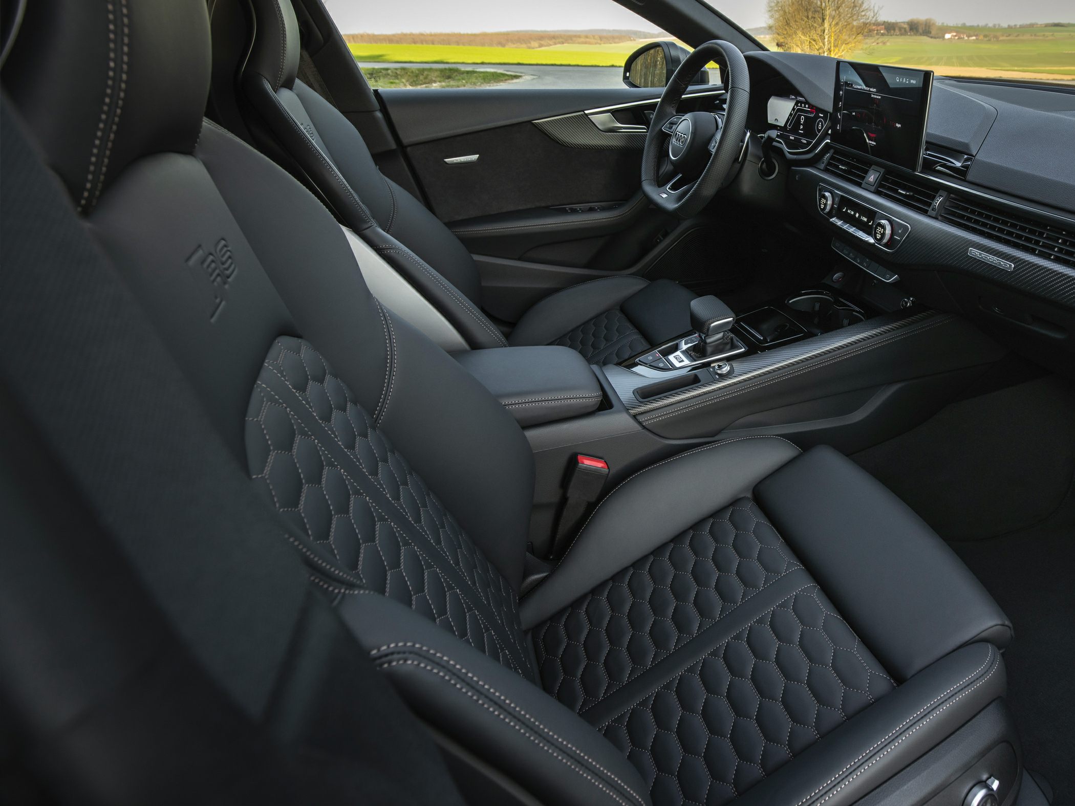 Luxury leather sport seats and digital dashboard with carbon fiber elements