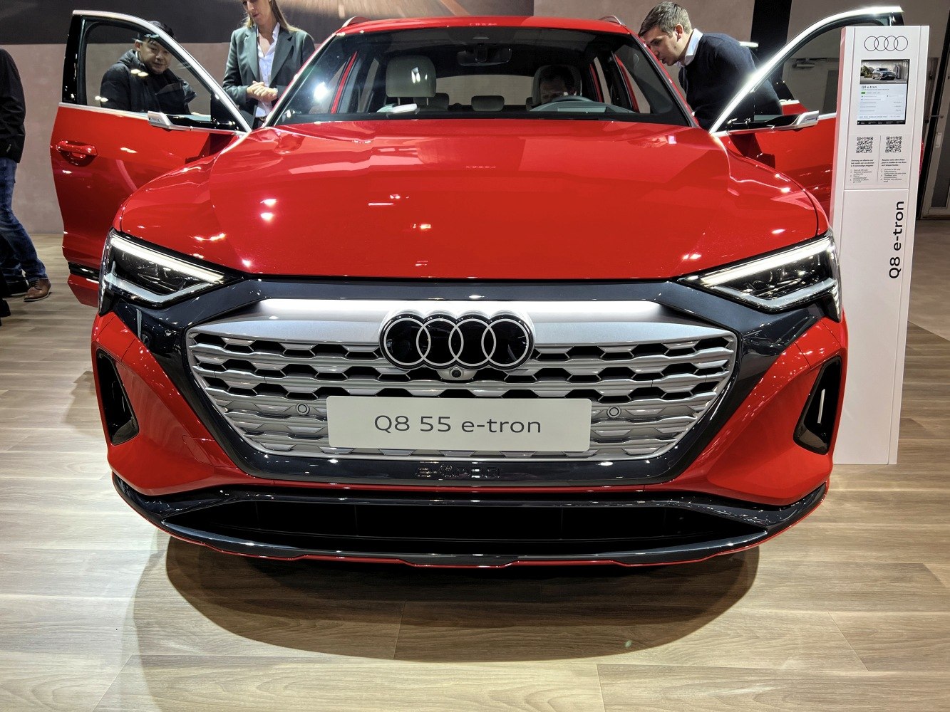 Close-up of front LED headlights and honeycomb grille