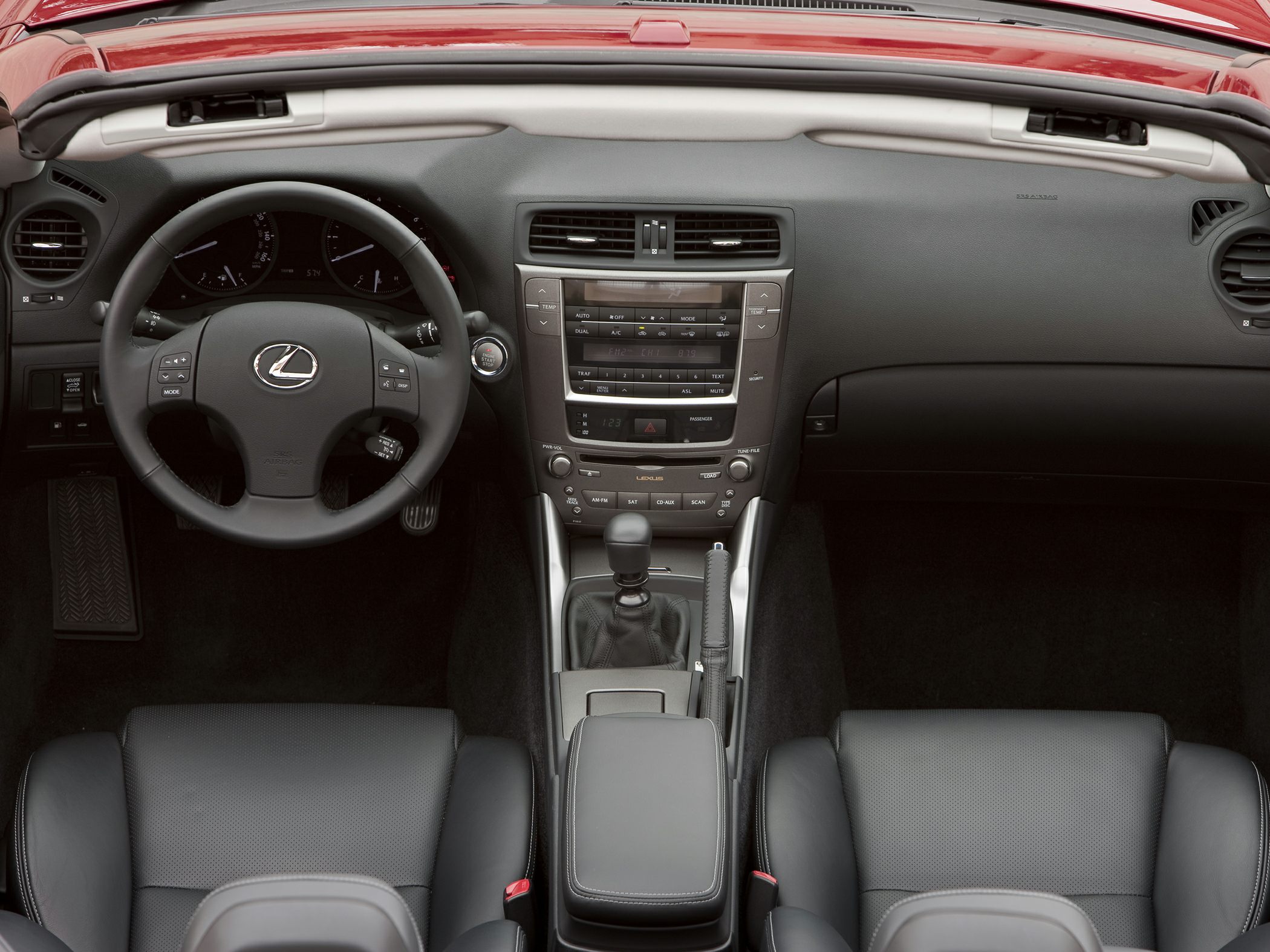 Convertible interior with manual transmission and modern dashboard controls
