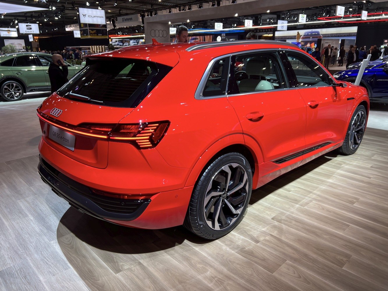 Red electric SUV rear and side view with digital taillights and alloy wheels