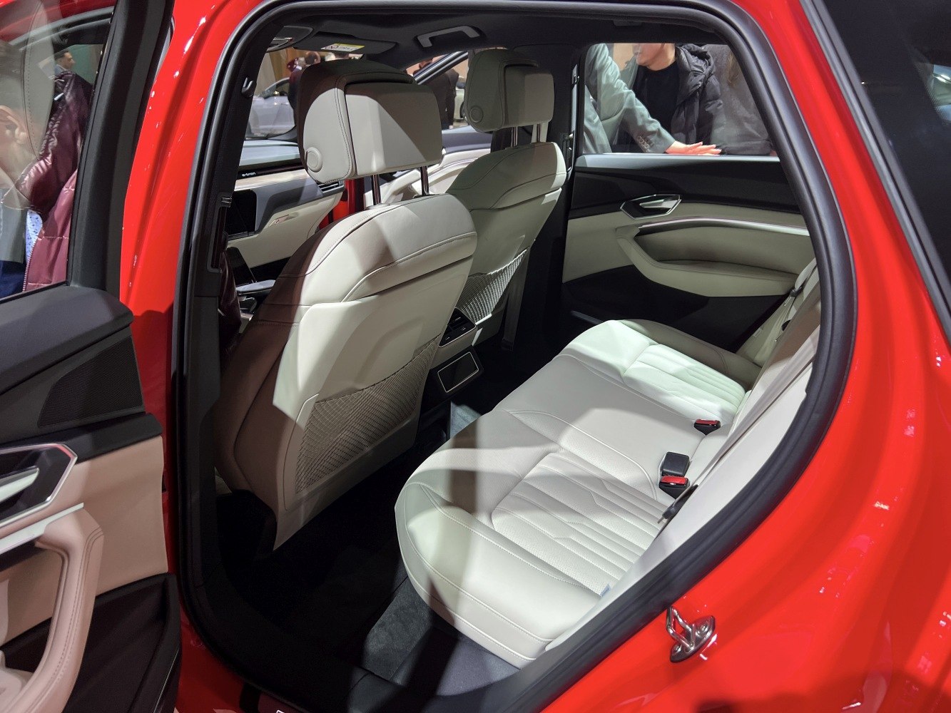 Beige leather rear seats and spacious interior of a modern SUV