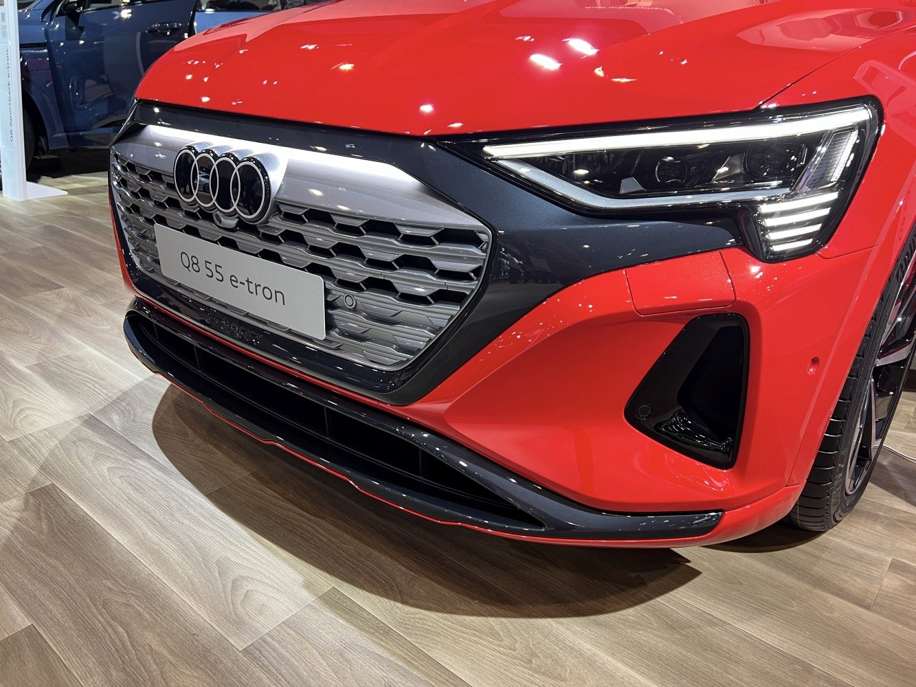 Close-up of a modern SUV front grille and LED headlight design