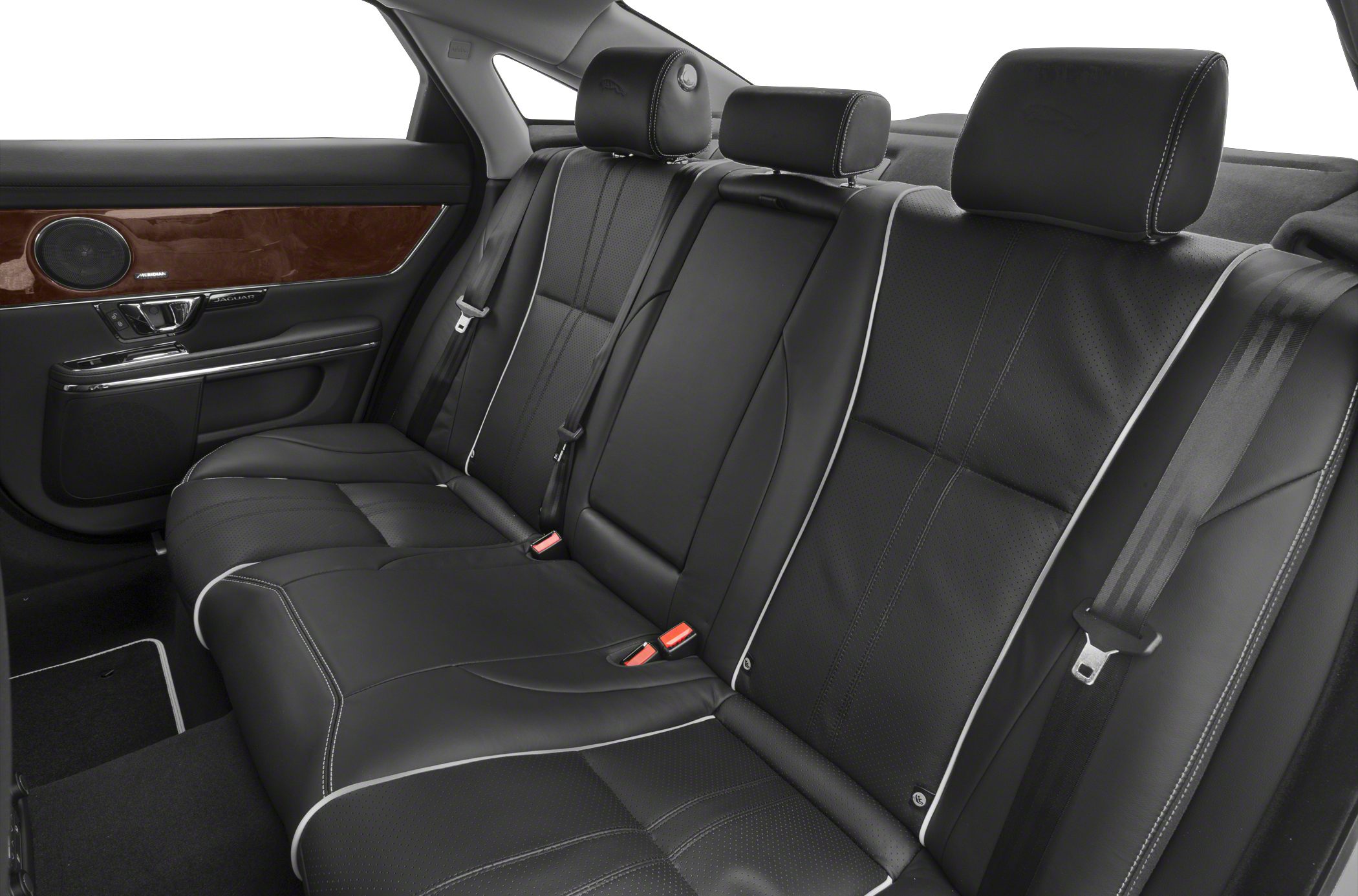 Black leather rear seats with white piping and wood trim