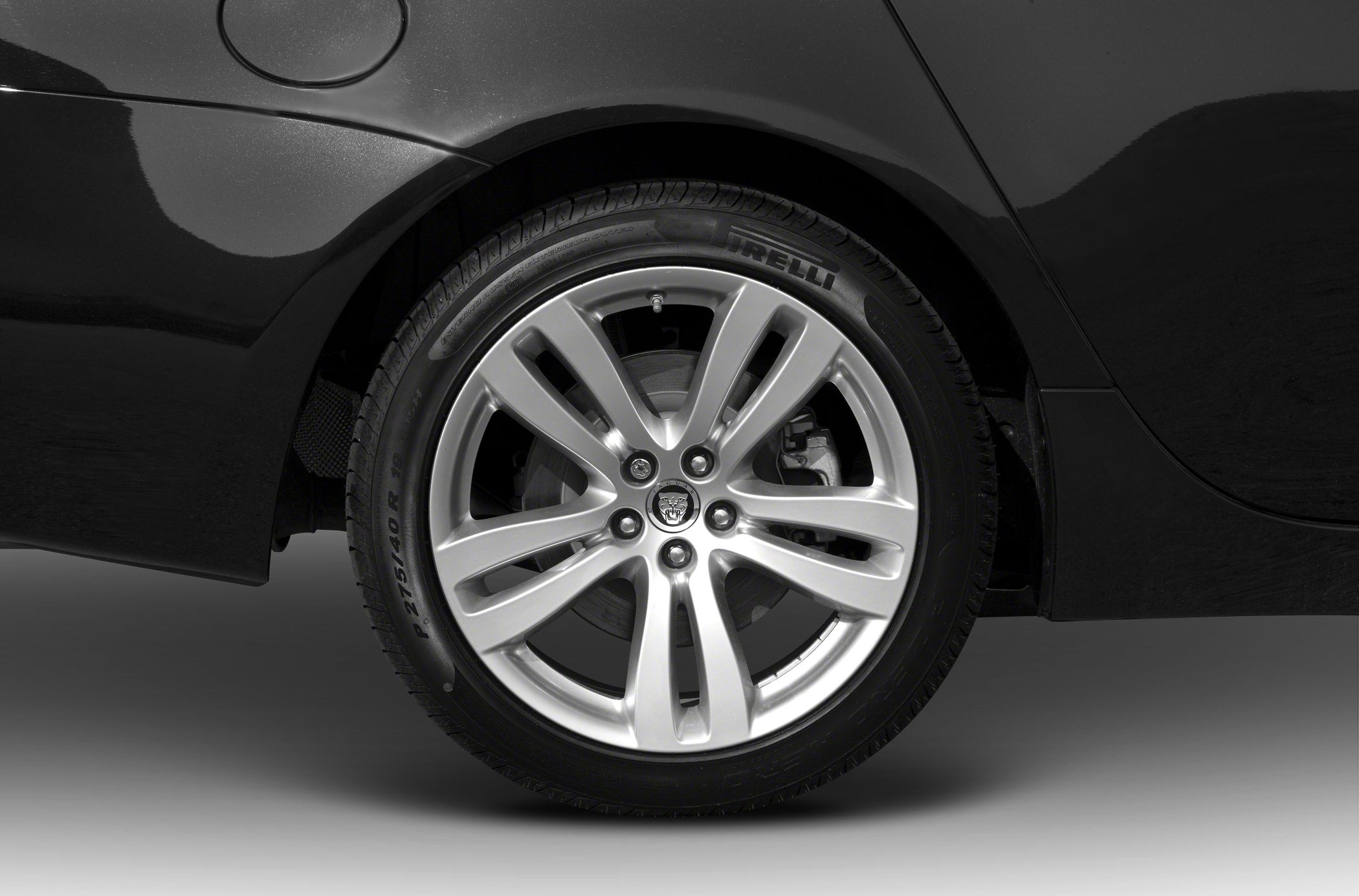 Silver alloy multi-spoke wheel with Pirelli tire close-up