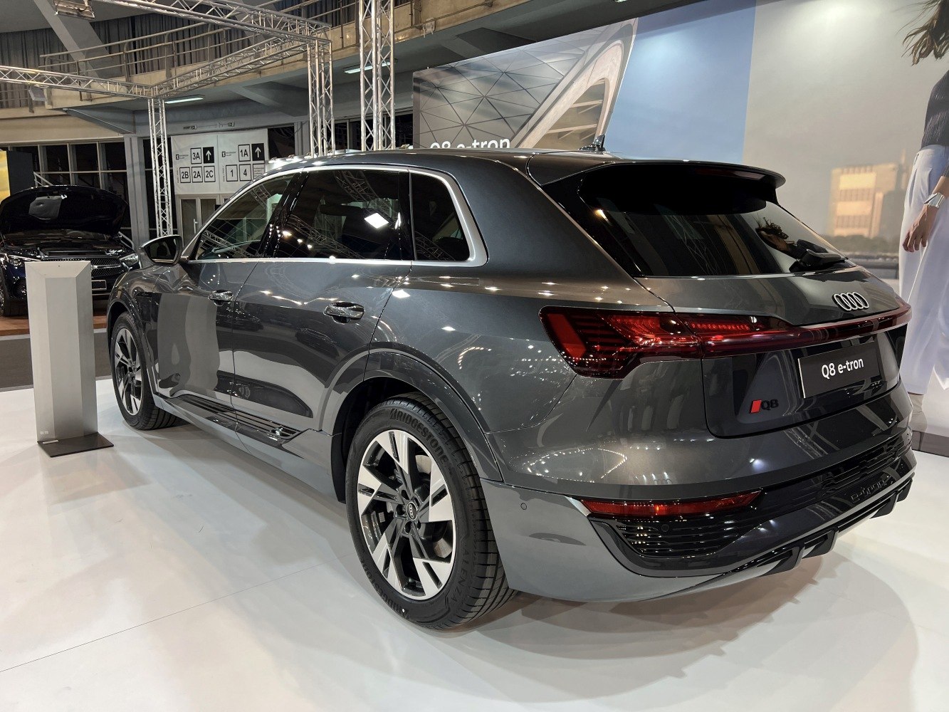 Rear view of an electric luxury SUV with distinctive LED taillights and aerodynamic design