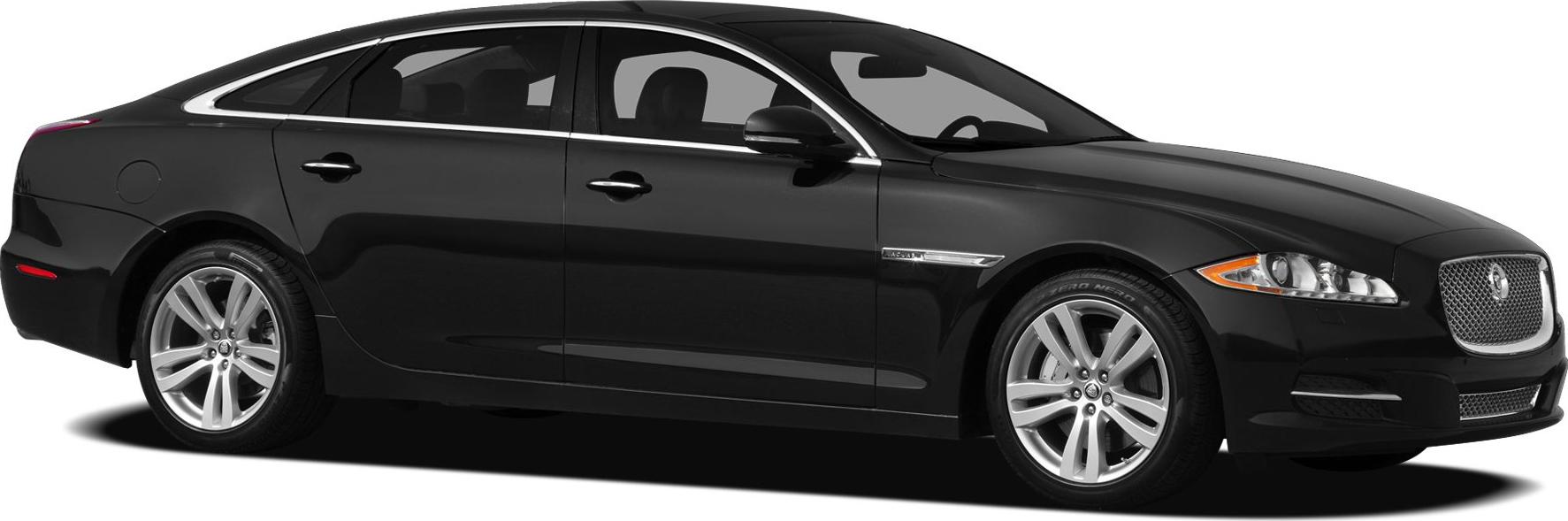 Side profile of sleek black luxury sedan with premium wheels.