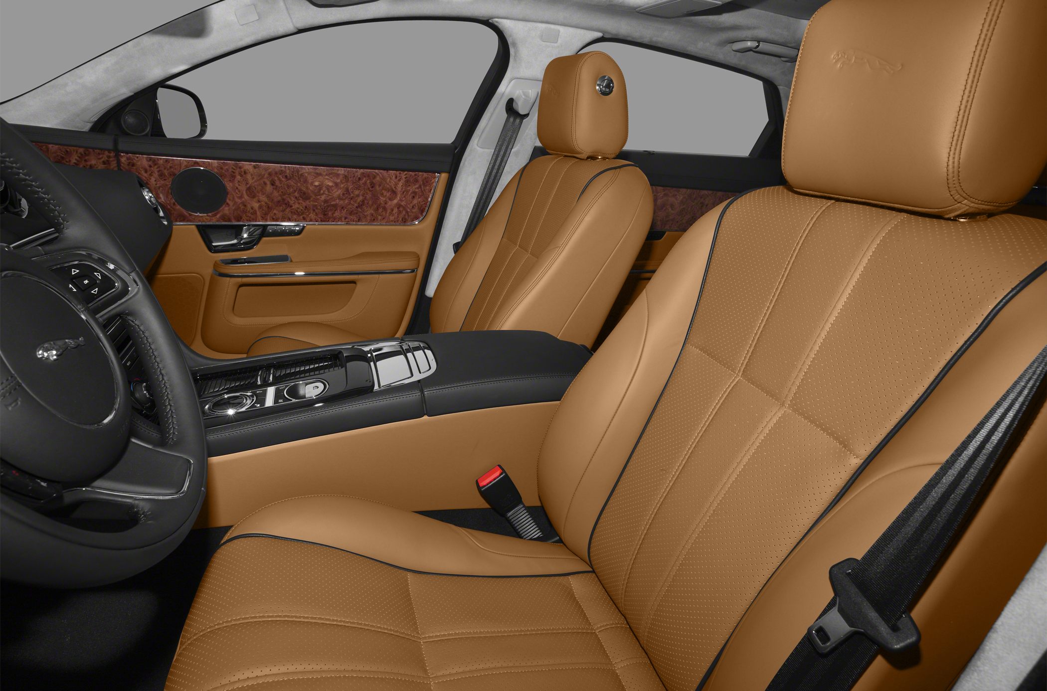Tan leather seats and wood trim interior in a luxury sedan