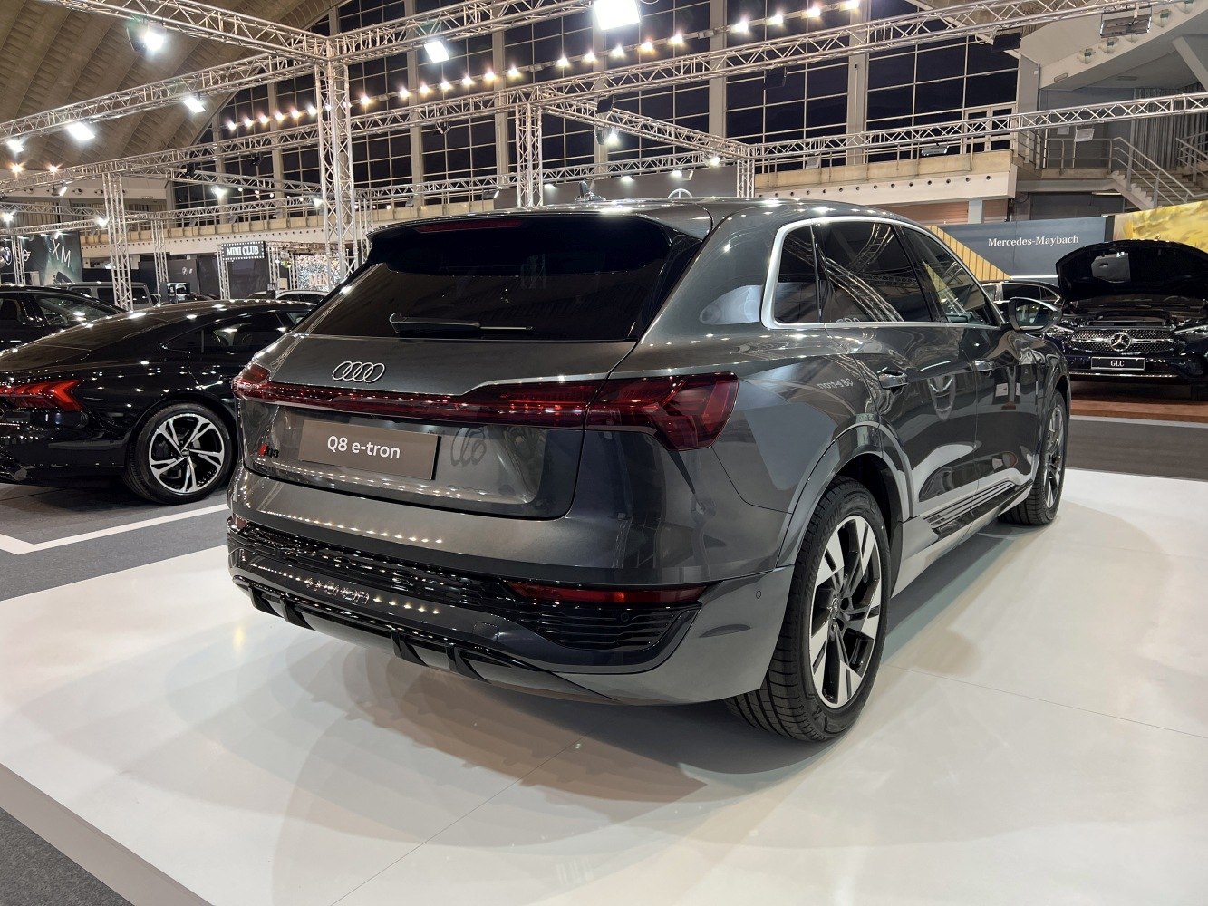 Rear view of electric SUV with sleek taillights and sporty wheels