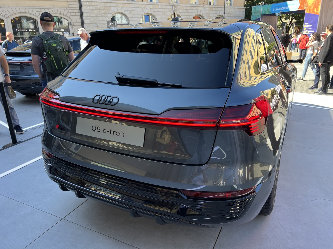 Rear view of electric SUV with full-width LED tail lights and tinted rear window