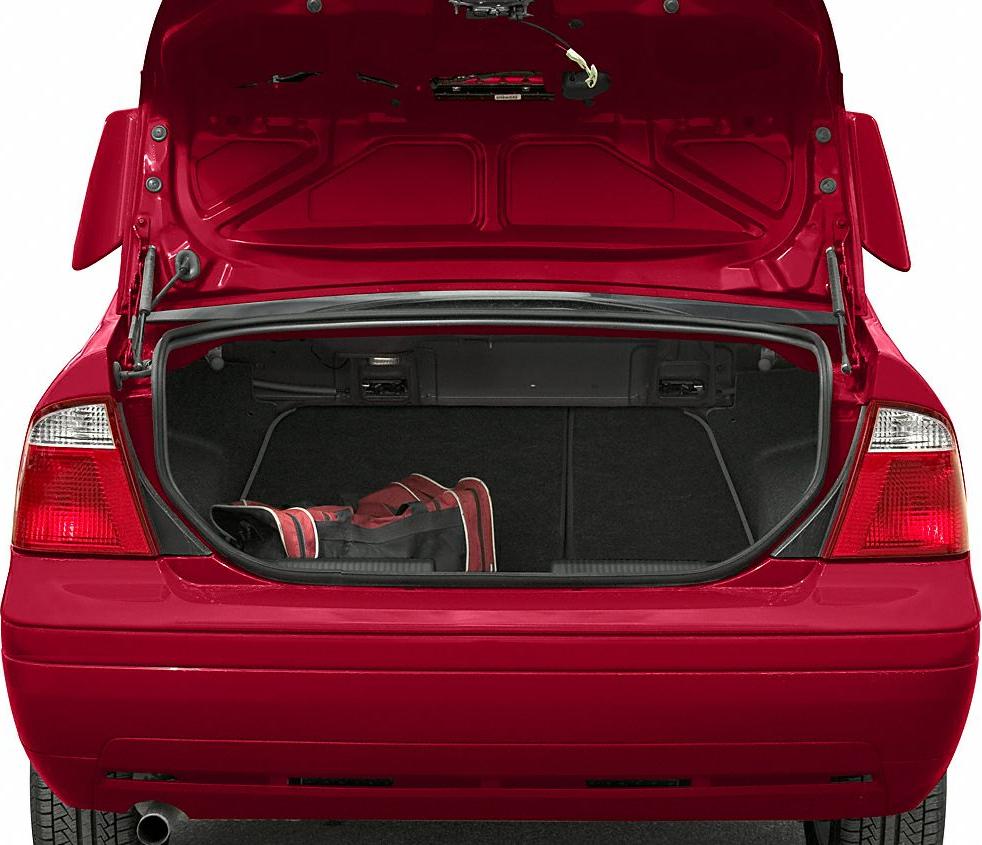 Open spacious car trunk with sports bag inside