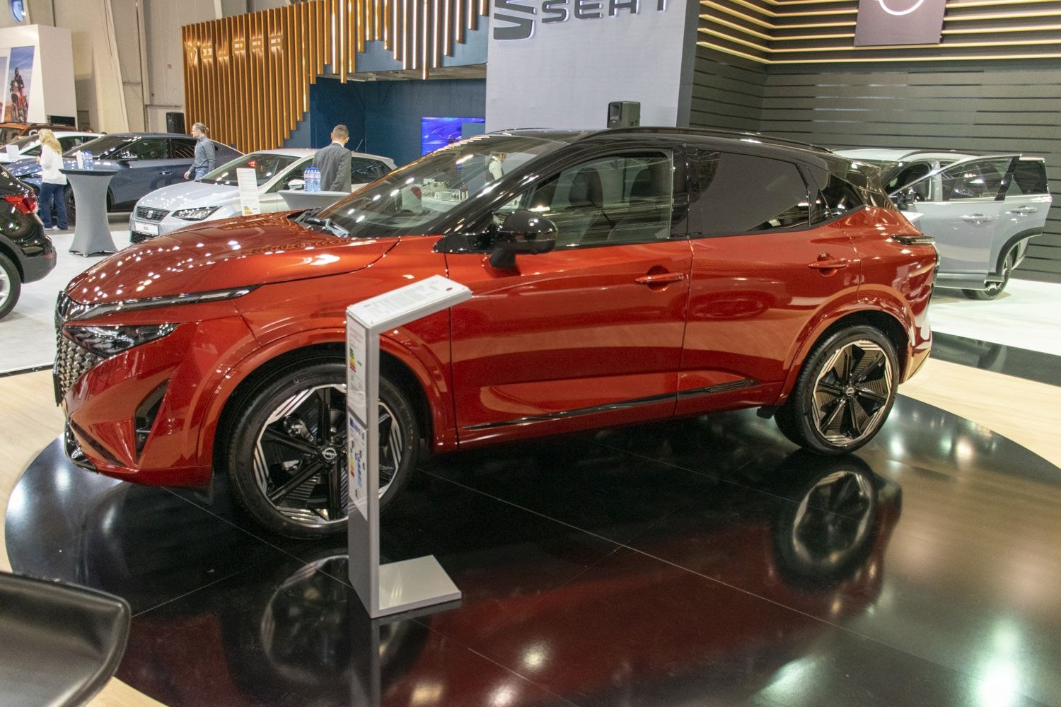Red crossover SUV with black roof and geometric alloy wheels
