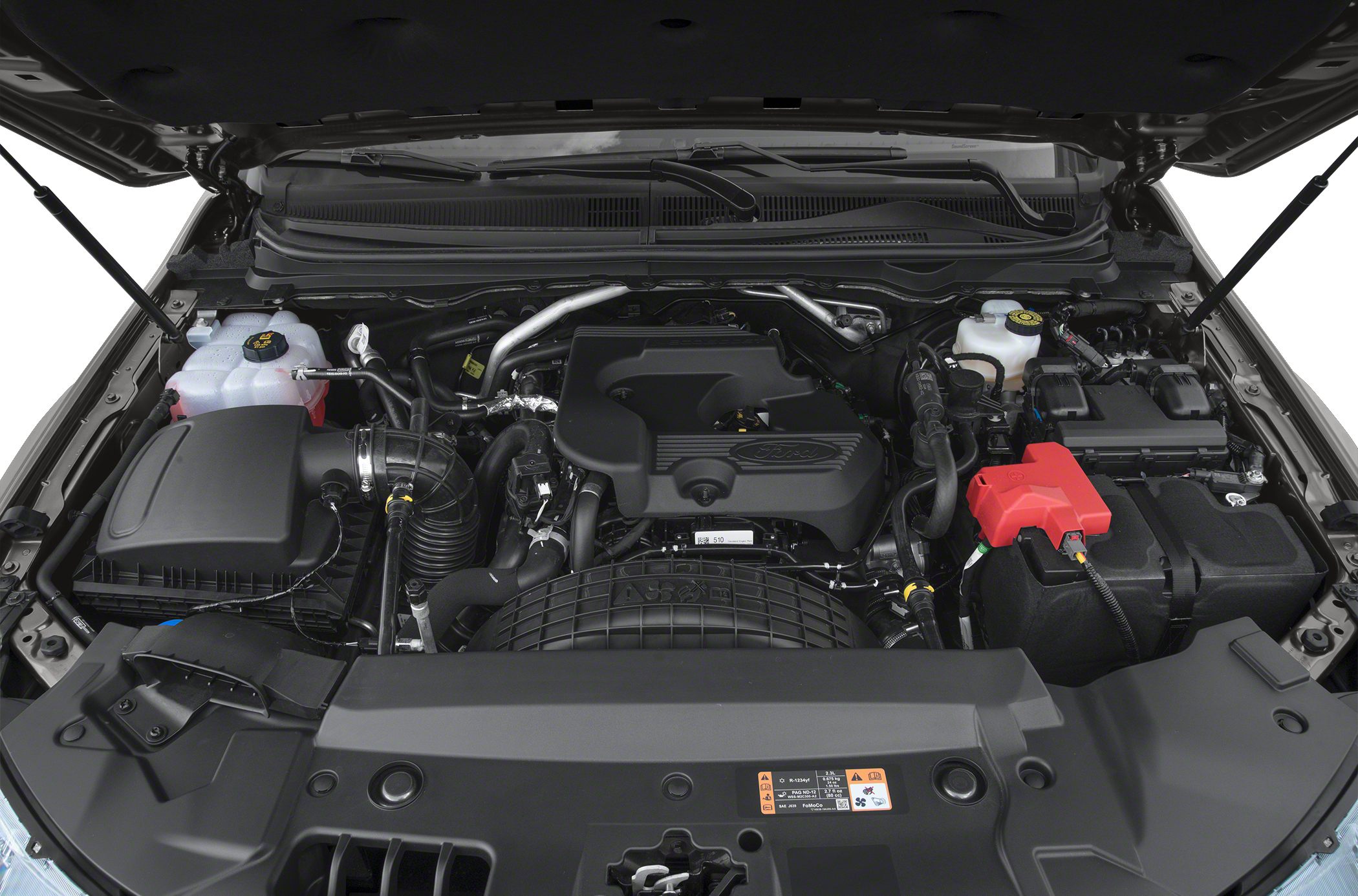 Engine bay with mechanical components and fluid reservoirs