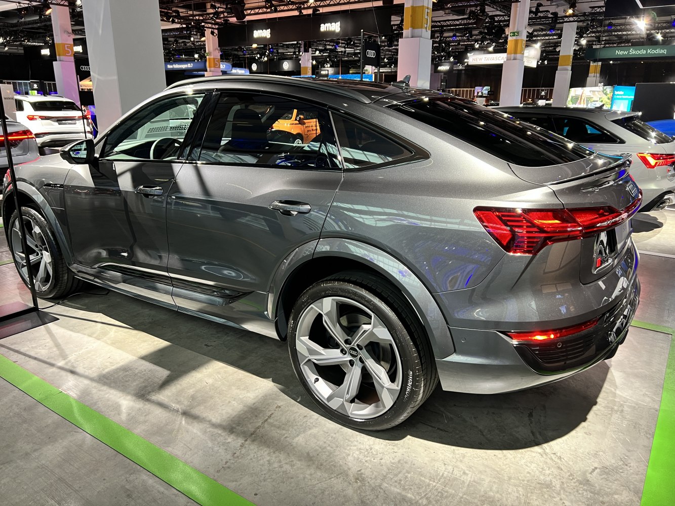 Rear side view of an SUV coupe with LED tail lights and alloy wheels