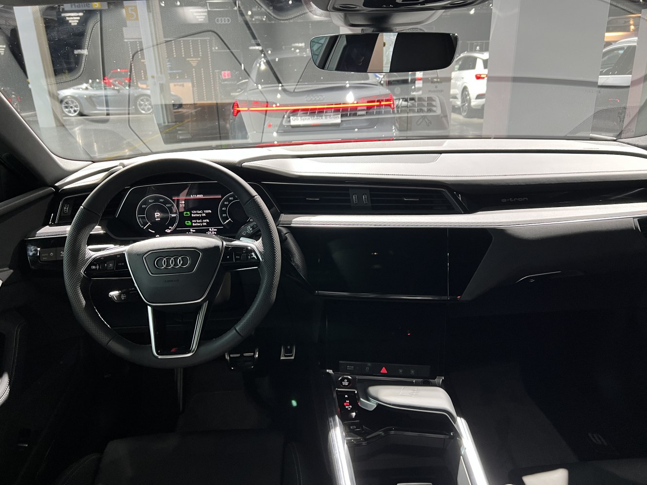 Digital instrument cluster and large central touchscreen in modern electric SUV interior