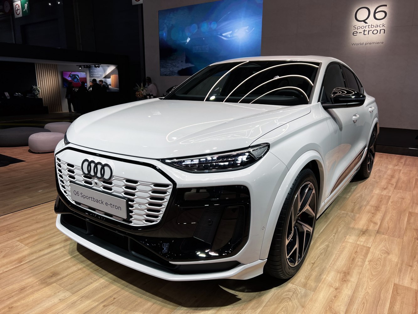 White electric SUV with distinctive front grille and LED headlights