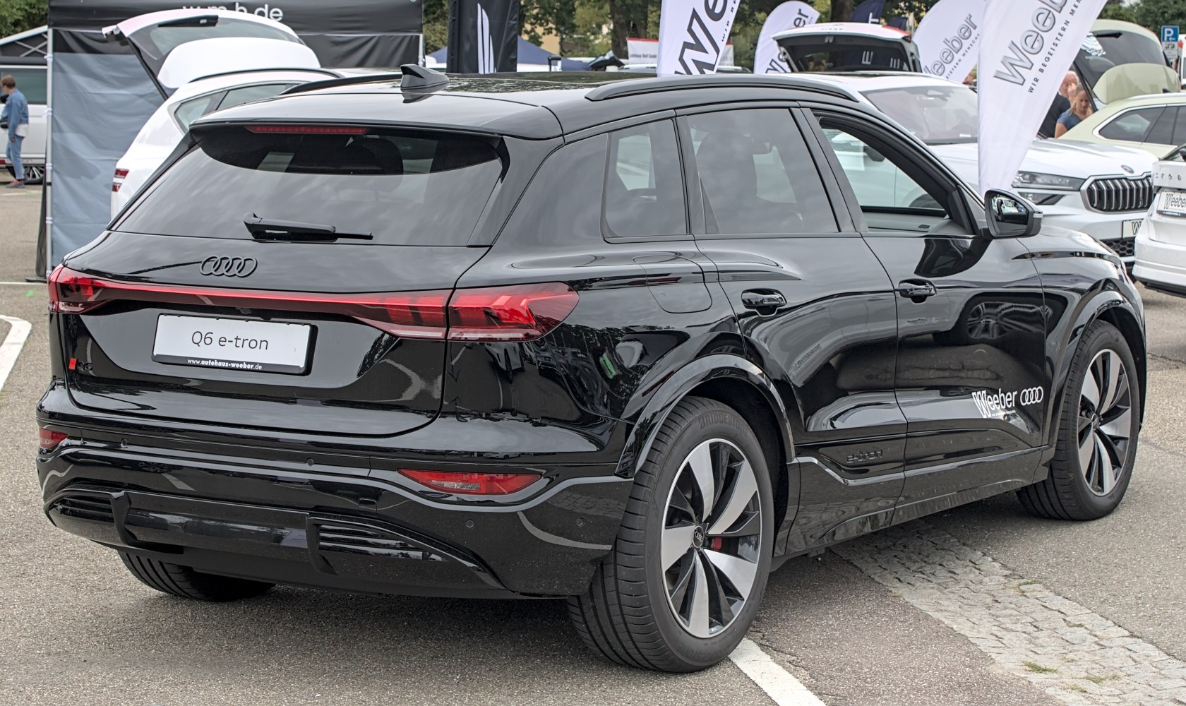 Rear and side view of electric SUV with LED taillights and alloy wheels