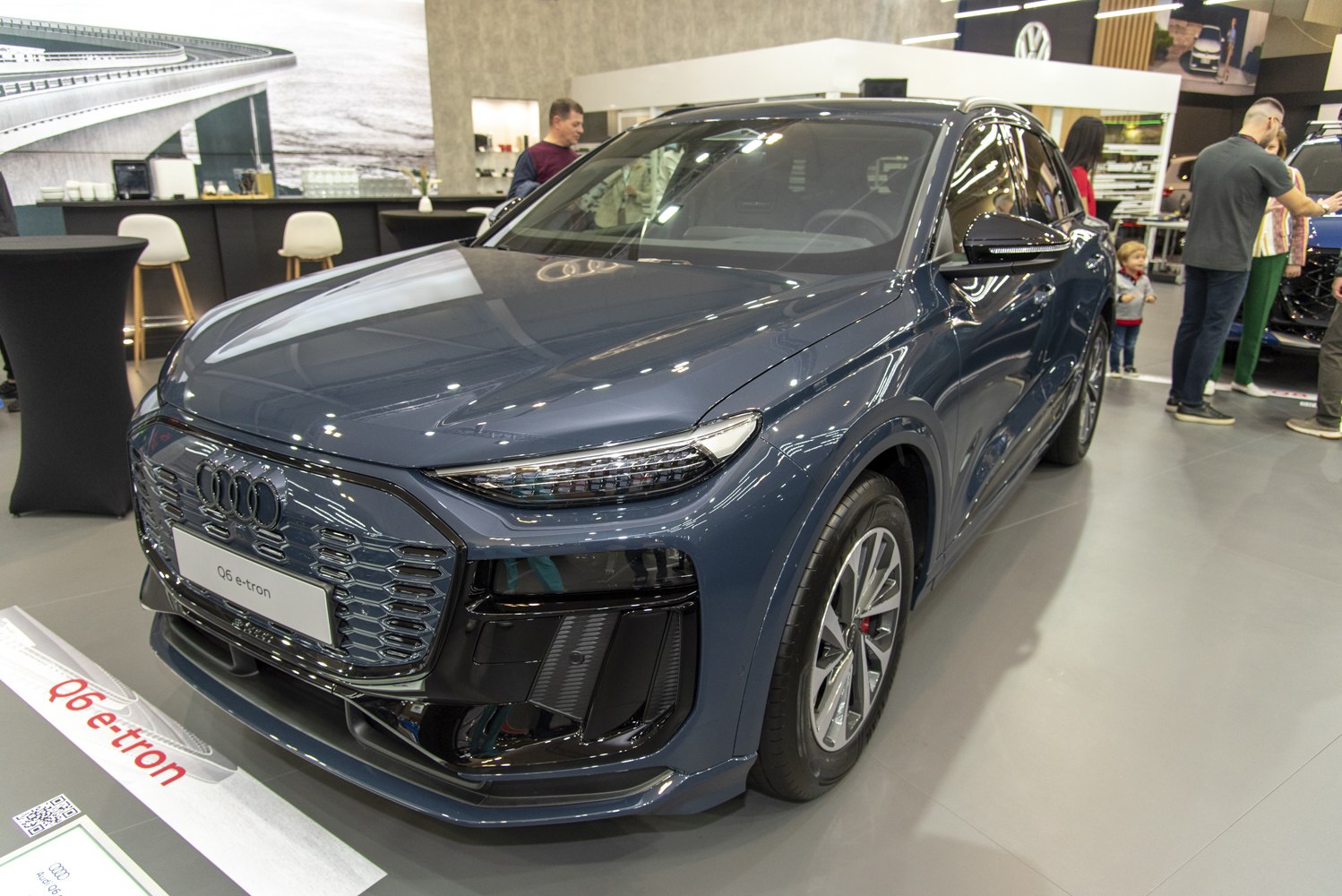Front view of electric SUV with hexagonal grille and LED headlights