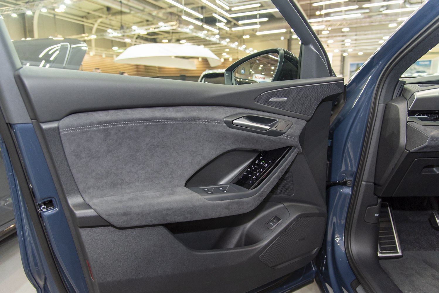 Interior door panel with window and mirror controls