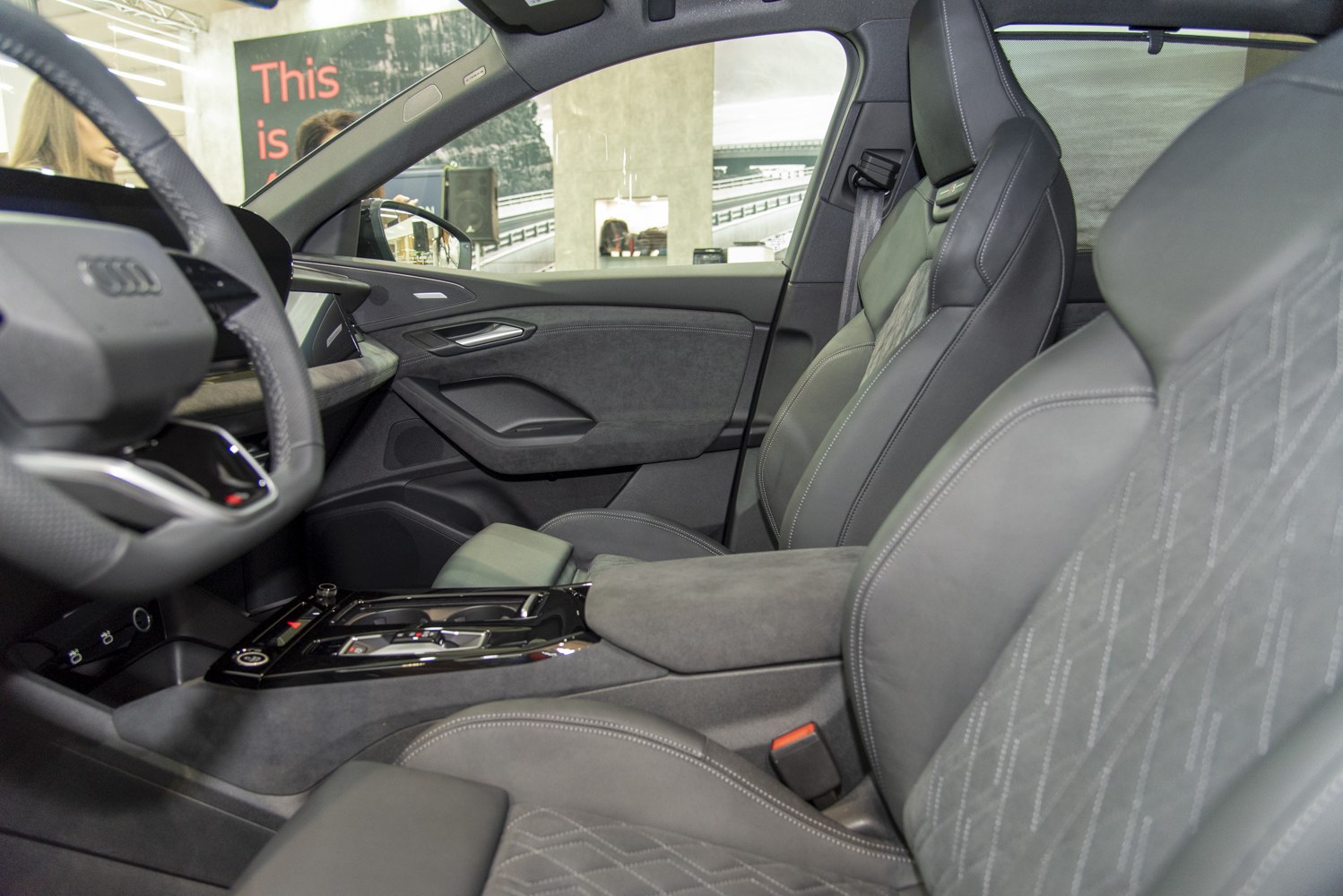 Luxury electric SUV front seats with advanced dashboard and center console