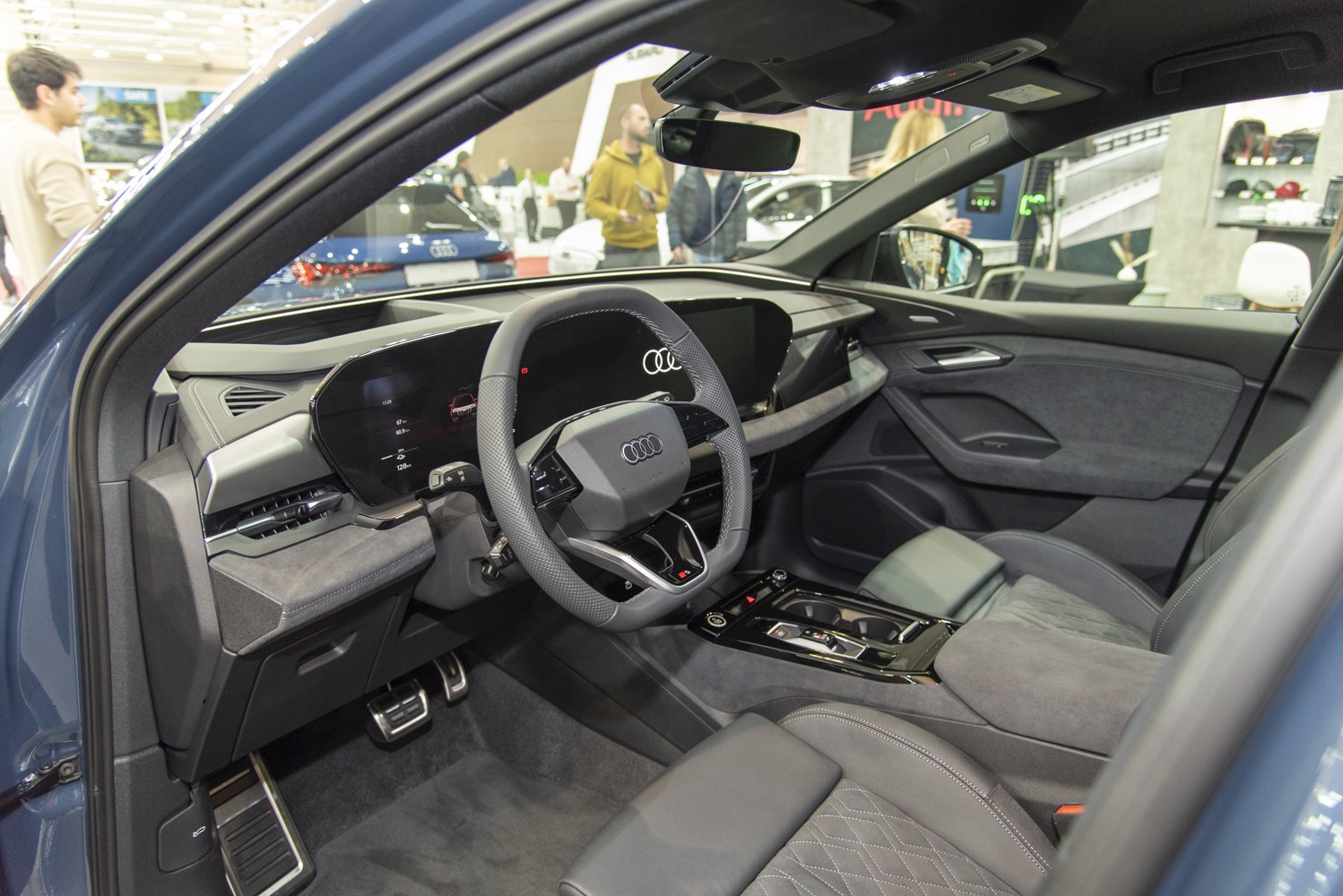 Digital dashboard and modern steering wheel in luxury car interior