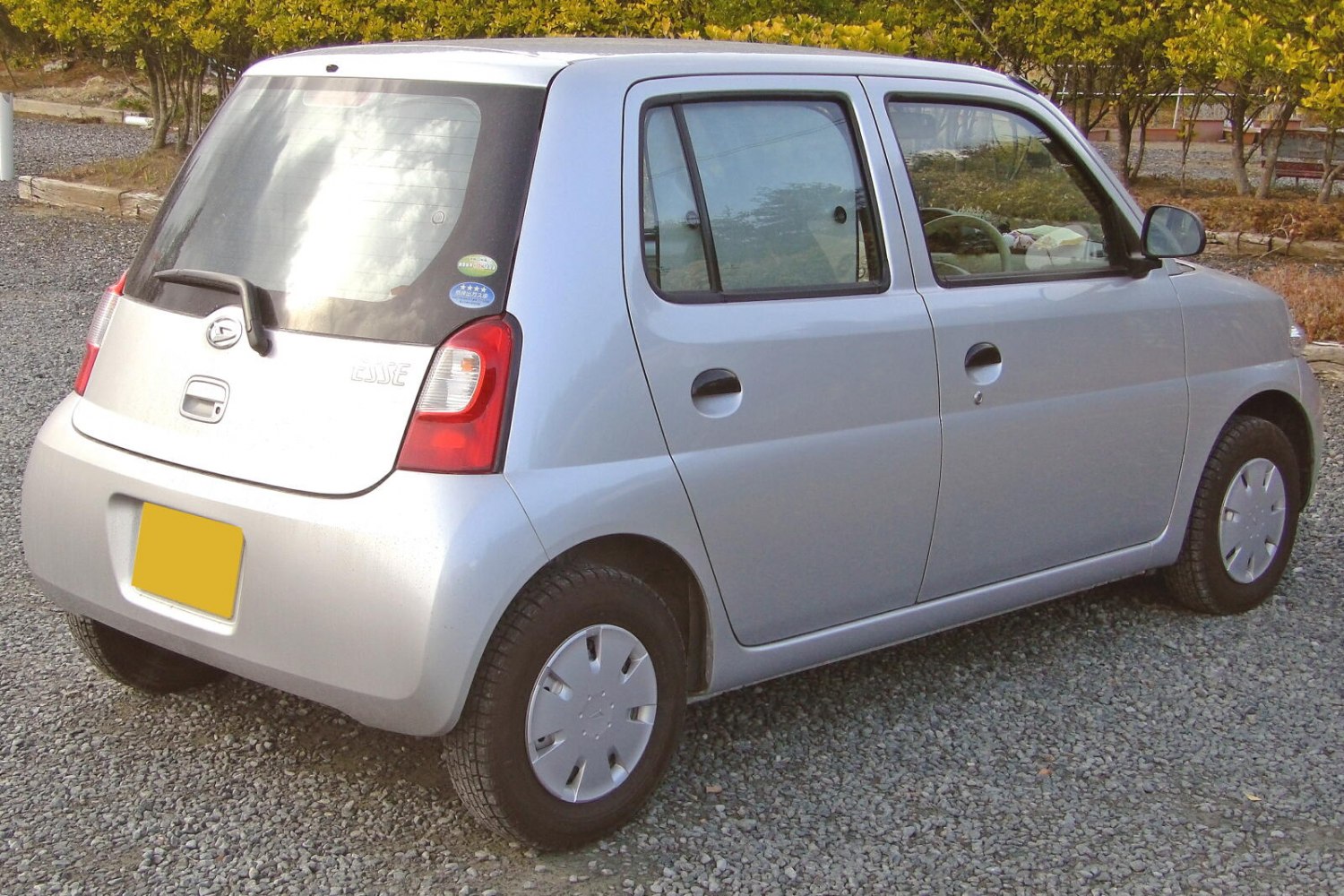 Compact hatchback rear with distinctive taillights and rear window wiper