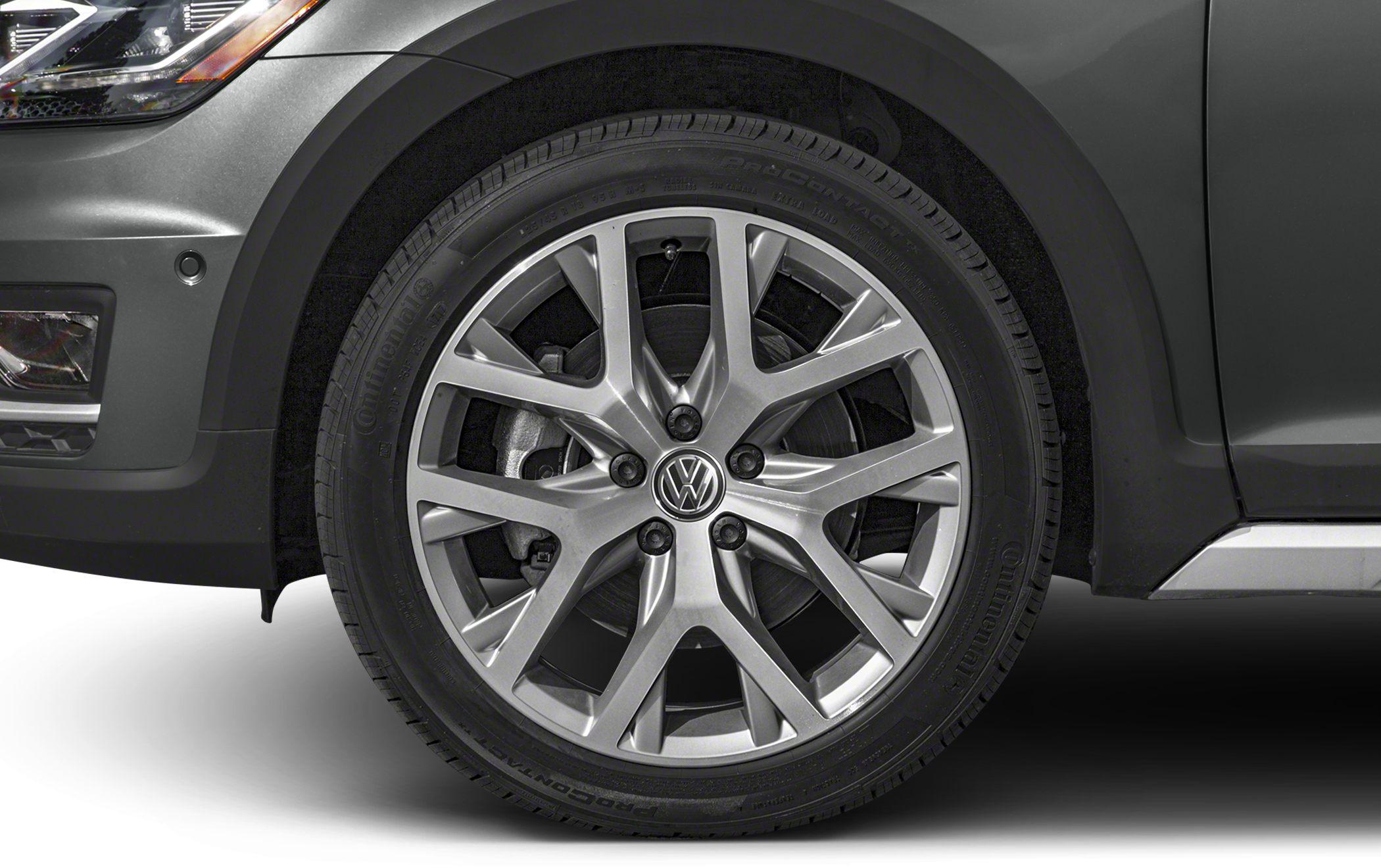 Close-up of silver alloy wheel and tire on a vehicle front side