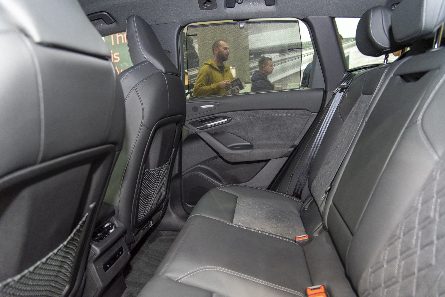 Luxurious rear seat with premium leather upholstery and spacious comfort.