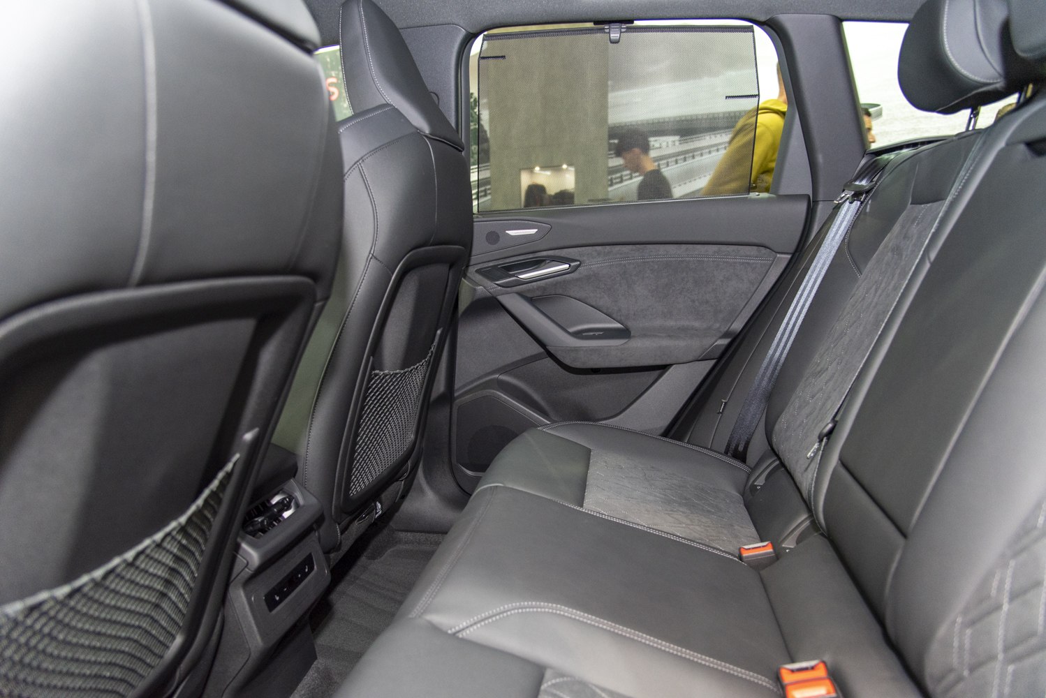 Rear passenger seats with premium upholstery and door panel details