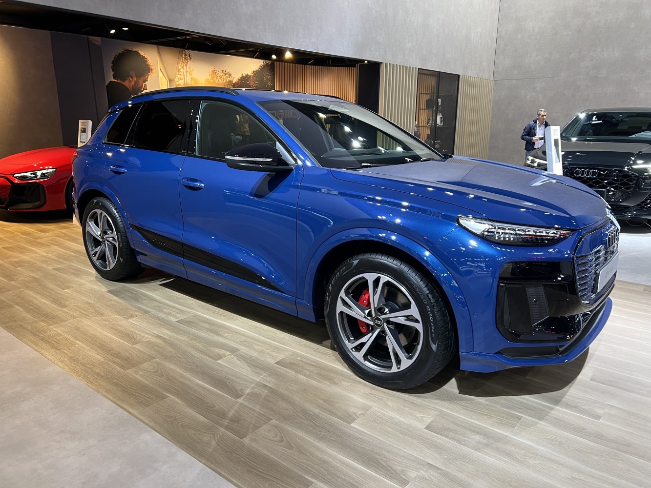 Blue electric SUV with LED headlights and premium alloy wheels