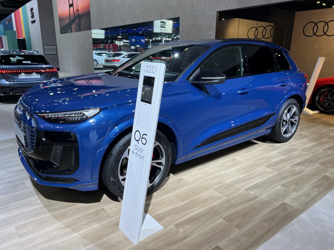 Blue electric SUV with modern front fascia and alloy wheels