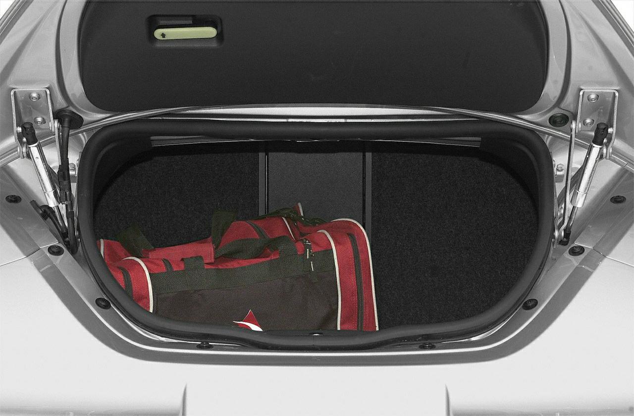 Open front trunk storage with a travel bag inside