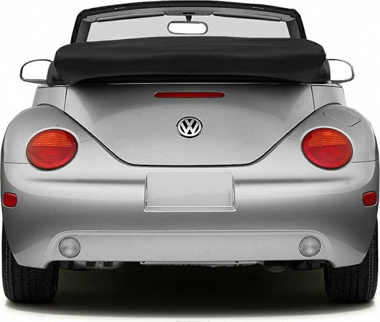 Rear of a convertible car with round taillights and folded soft top