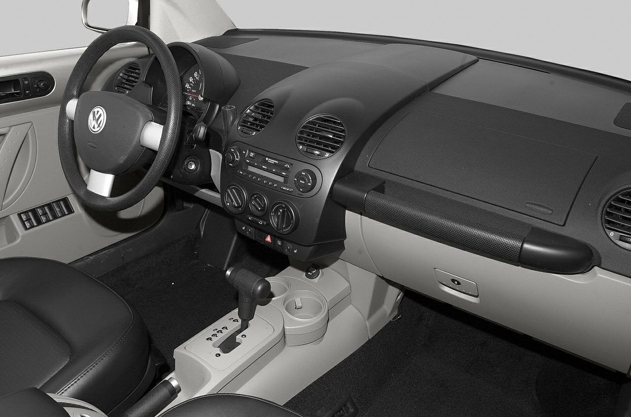 Dashboard and steering wheel interior with center console and gear shifter