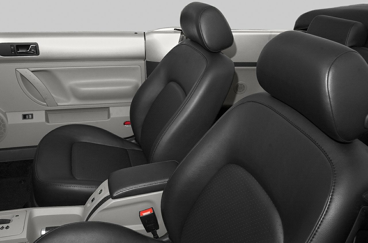 Black leather front seats and interior door panel of a convertible car