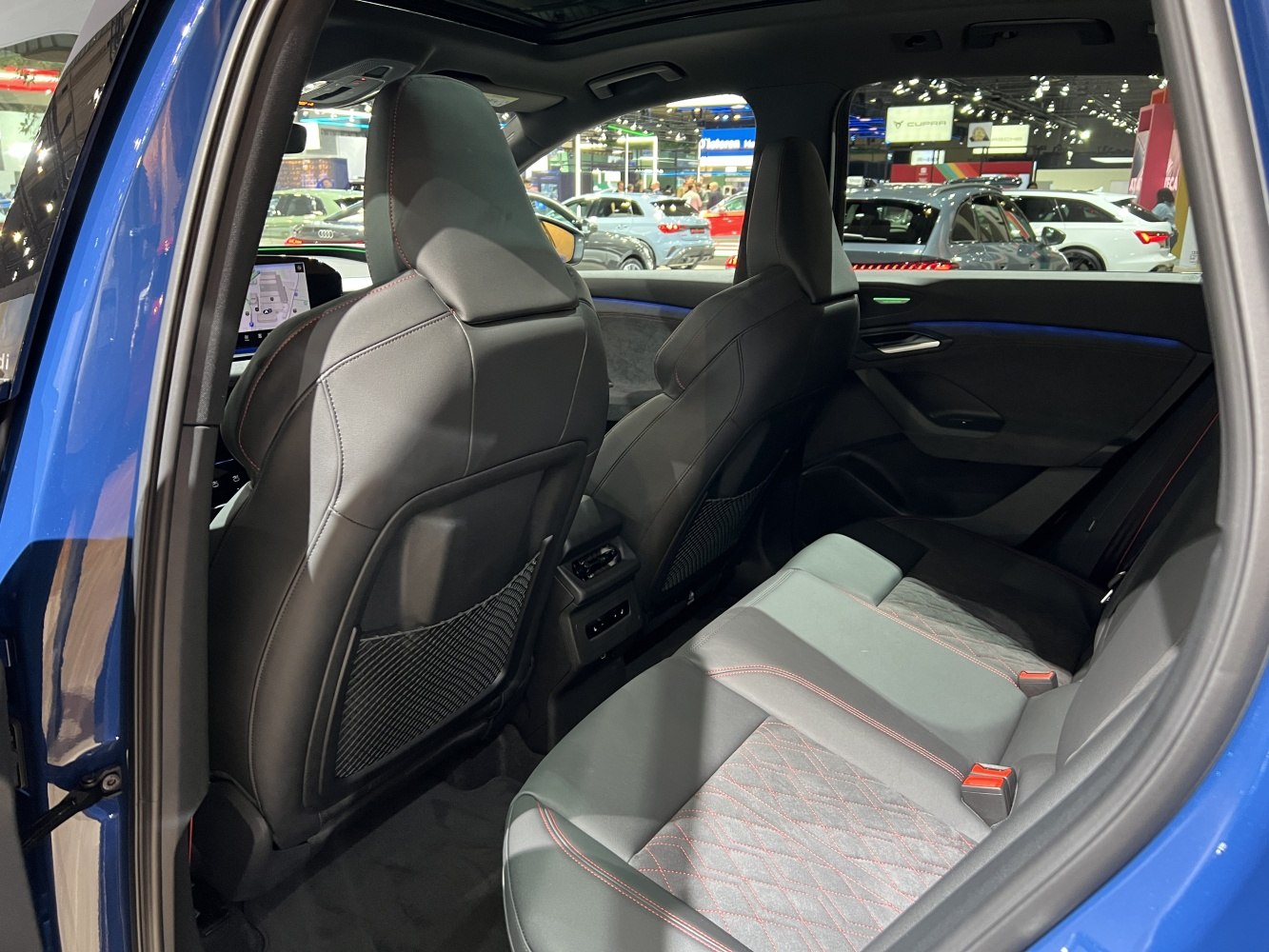 Rear passenger seating with quilted upholstery and ambient lighting