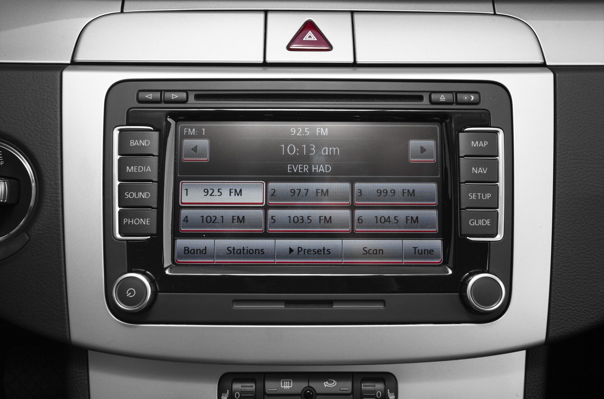 Close-up view of a radio and navigation console with media controls.