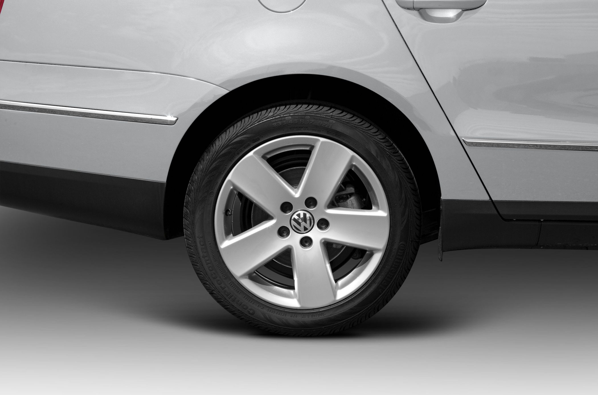 Close-up of alloy wheel and rear door panel section