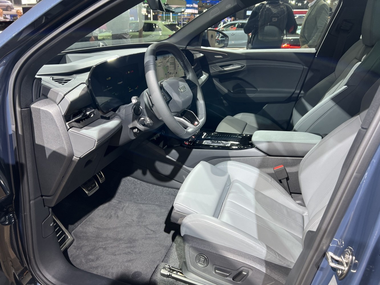 Modern digital dashboard and premium leather front seat