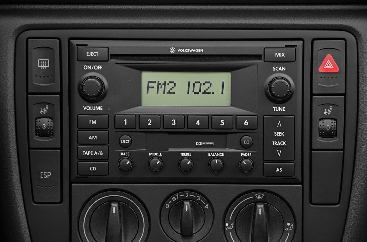 Classic car radio and climate control panel with FM tuning and heating dials