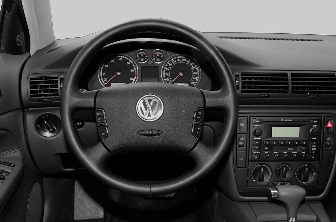 Dashboard and steering wheel with instrument cluster and control buttons