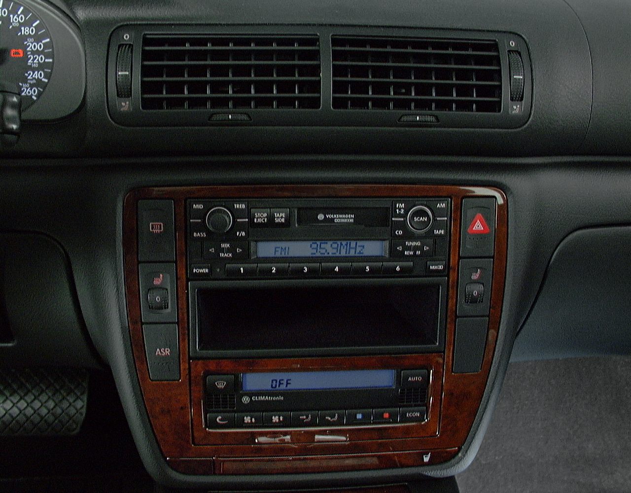 Dashboard air vents, central audio system, and climate control panel.