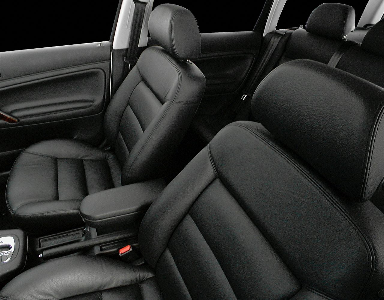 Black leather front seats and armrest in car interior