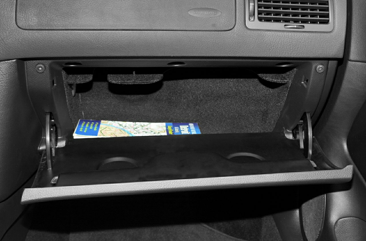 Open glove compartment with inner storage space and map booklet