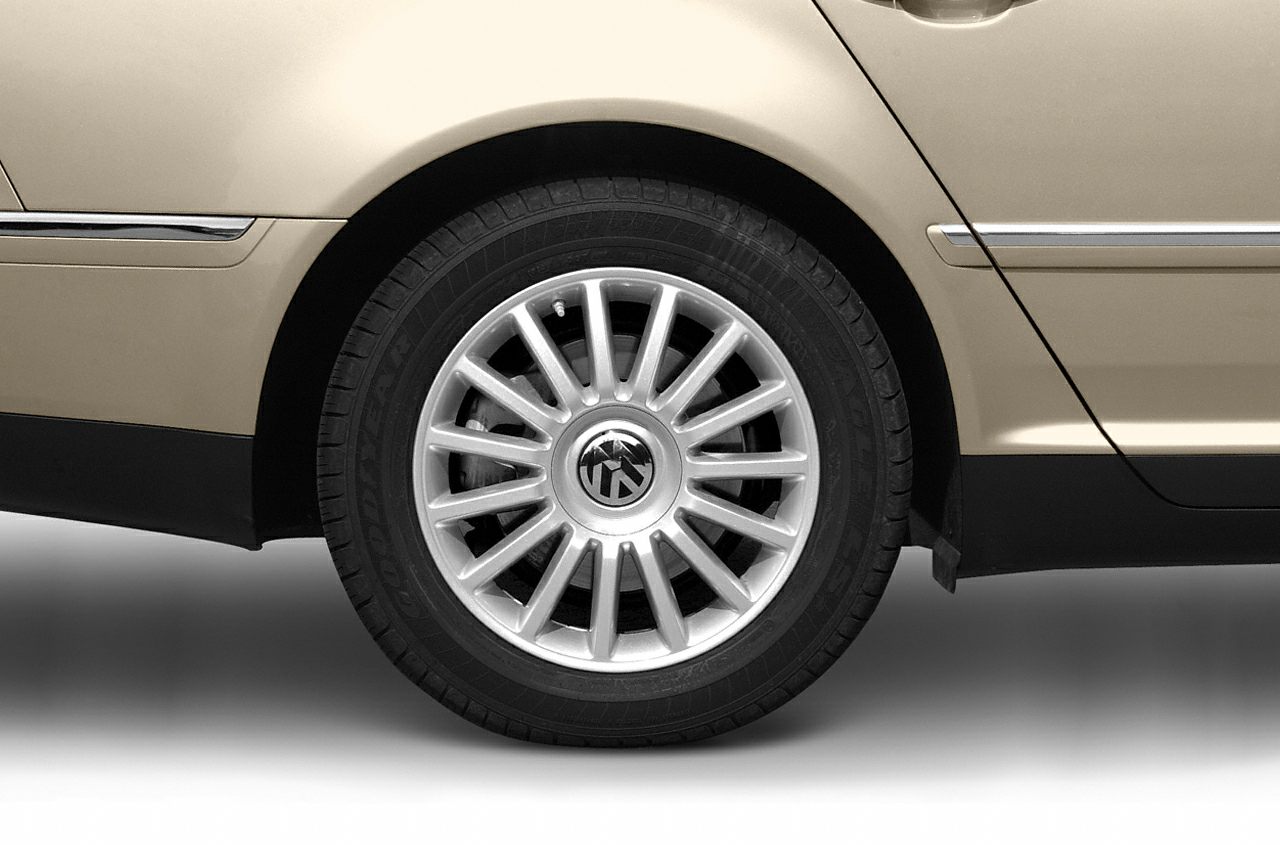 Close-up of multi-spoke alloy wheel on sedan rear side