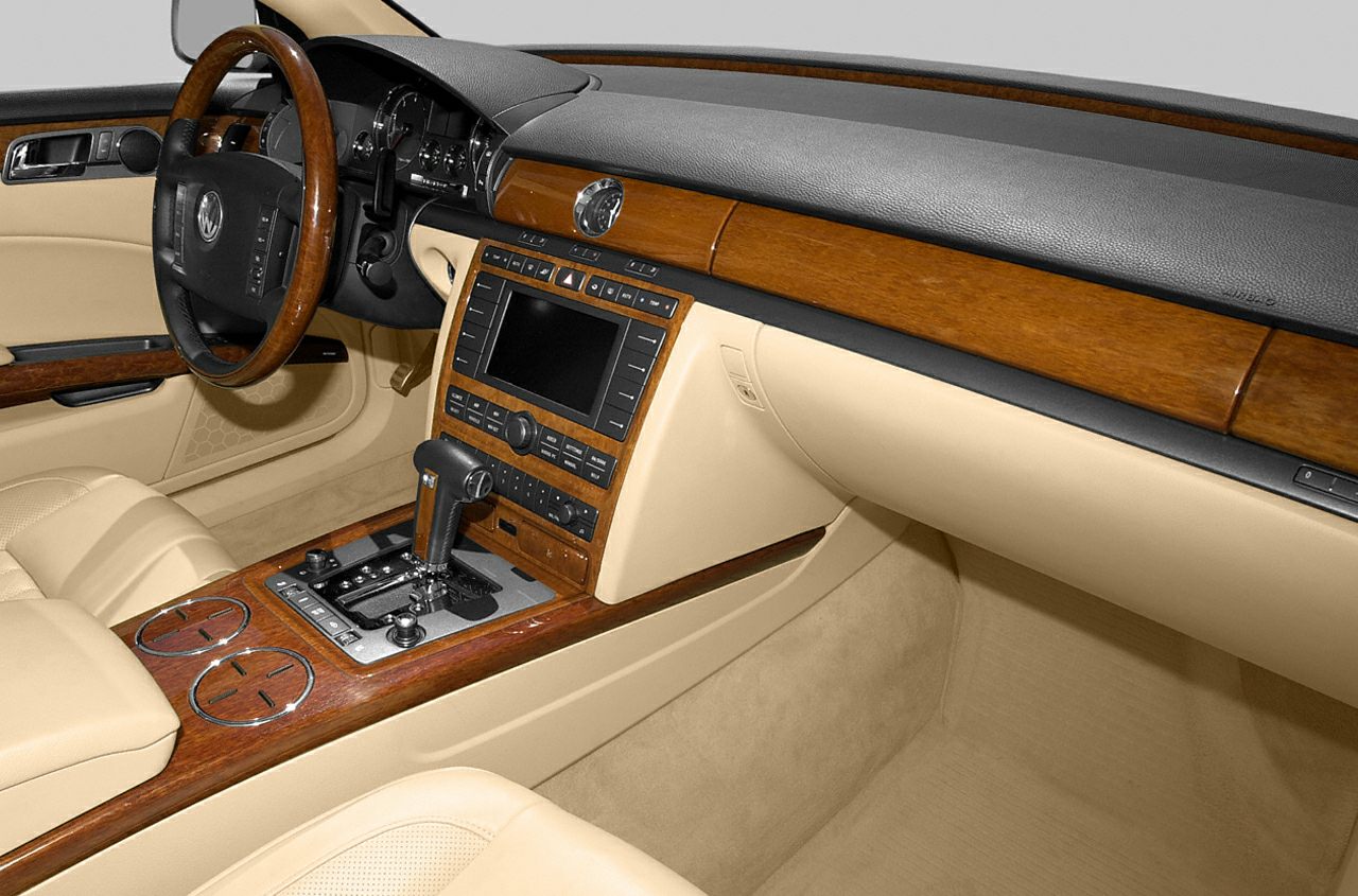 Beige leather interior with wood trim and automatic gear shift