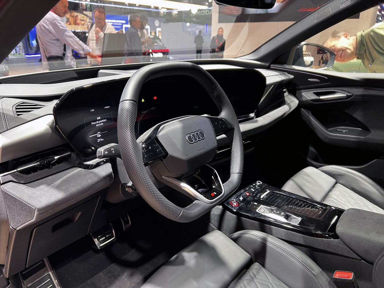 Digital dashboard and sporty steering wheel in luxury SUV interior