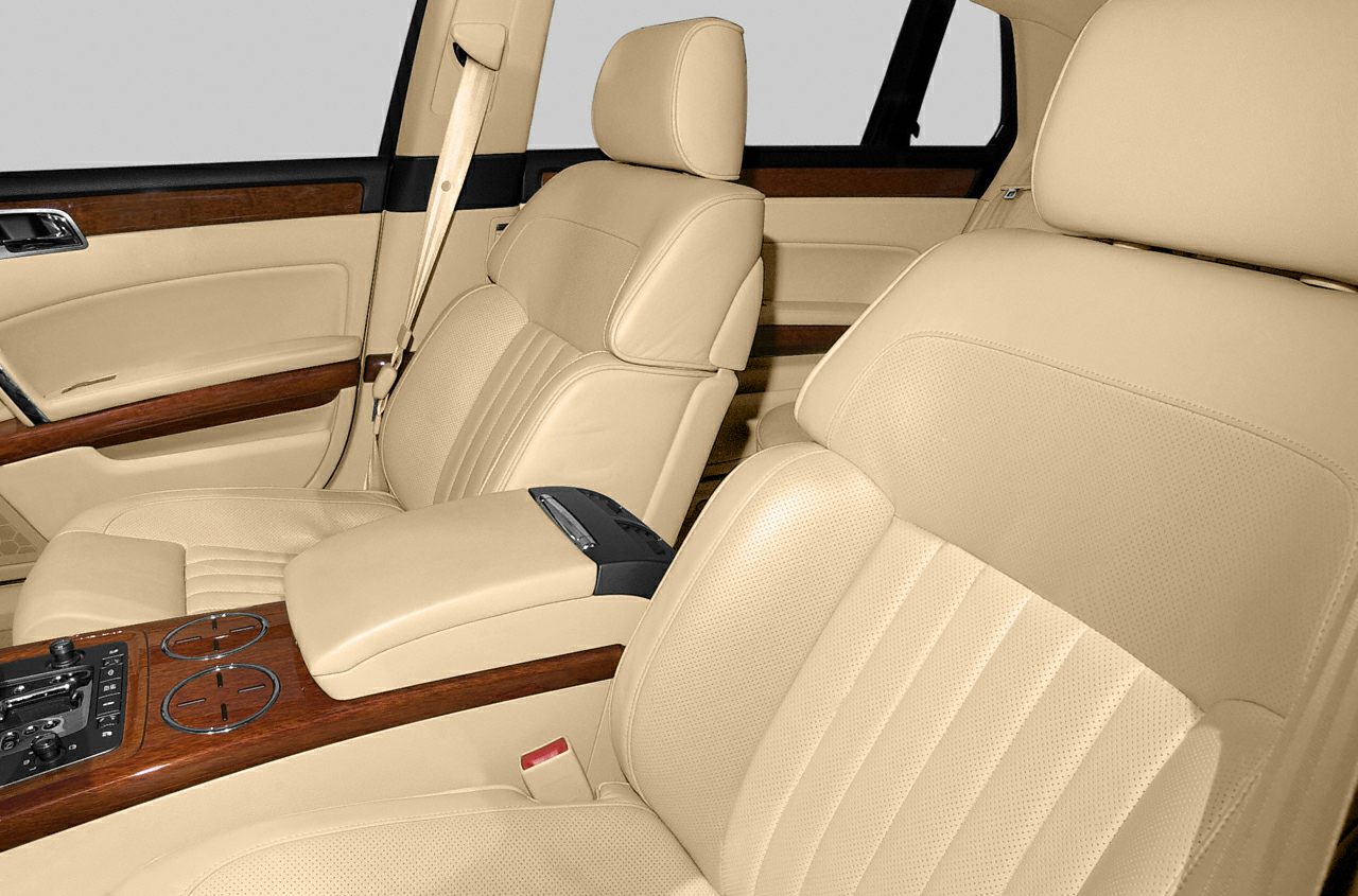 Beige leather seats with wood trim and central console controls