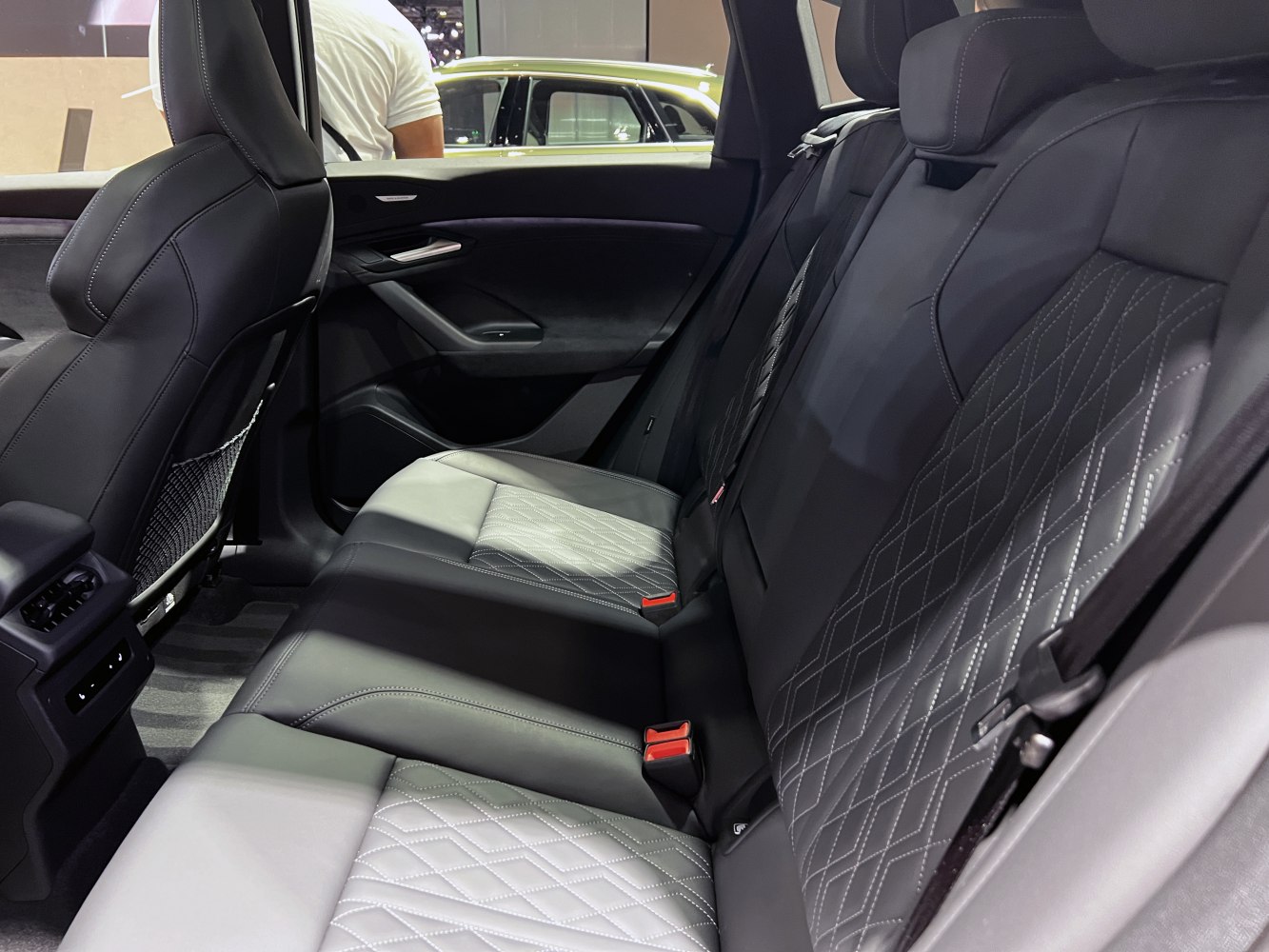 Premium rear leather seats with diamond stitching and spacious cabin.